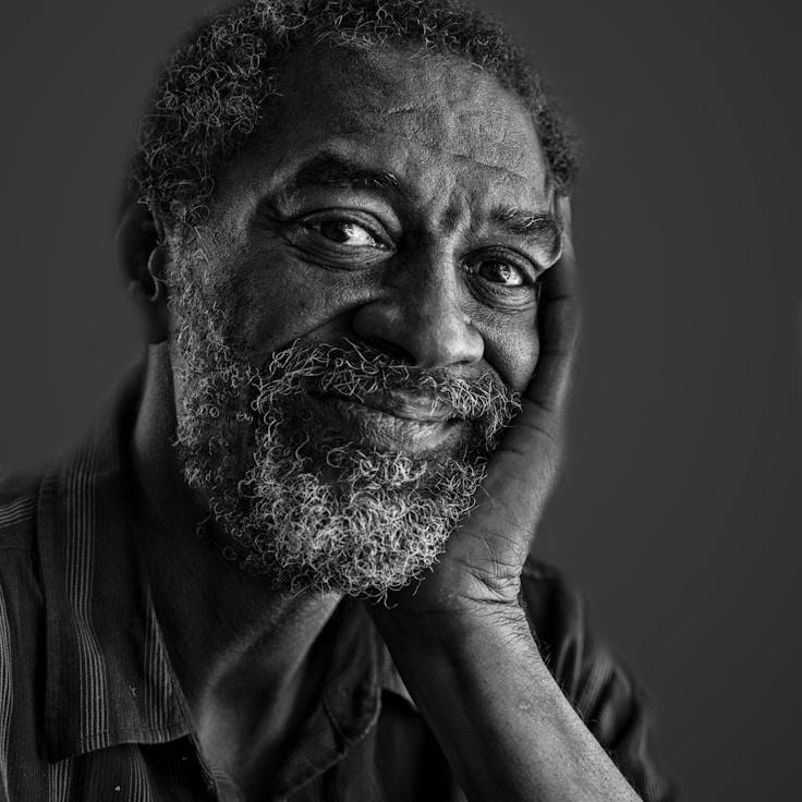 Alex Doe, Lead Design Curator at Lunar Harvest Wave, reviewing corporate floral arrangements